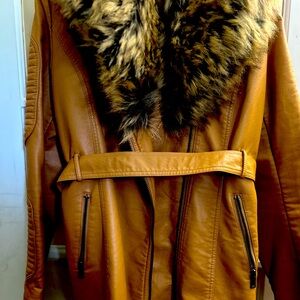 A leather jacket with fur collar